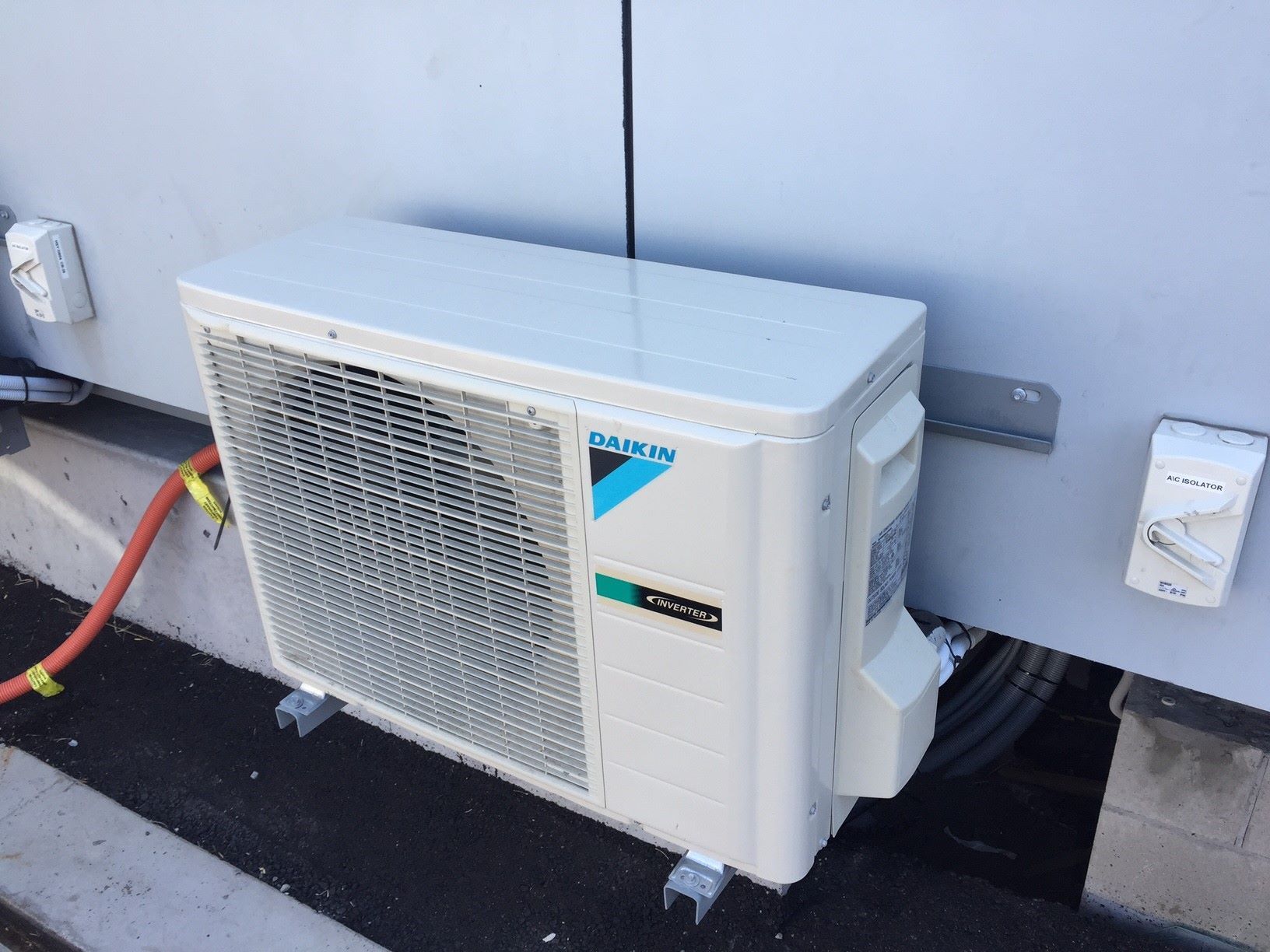 Installing Air Conditioner Outdoors — 7E Integrated Services In Port Stephens NSW