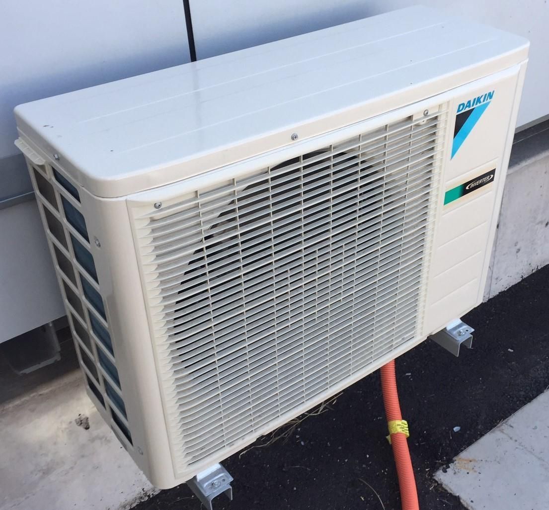 Air Conditioner Compressor Outdoor Unit Installed Outside The House — 7E Integrated Services In Newcastle NSW