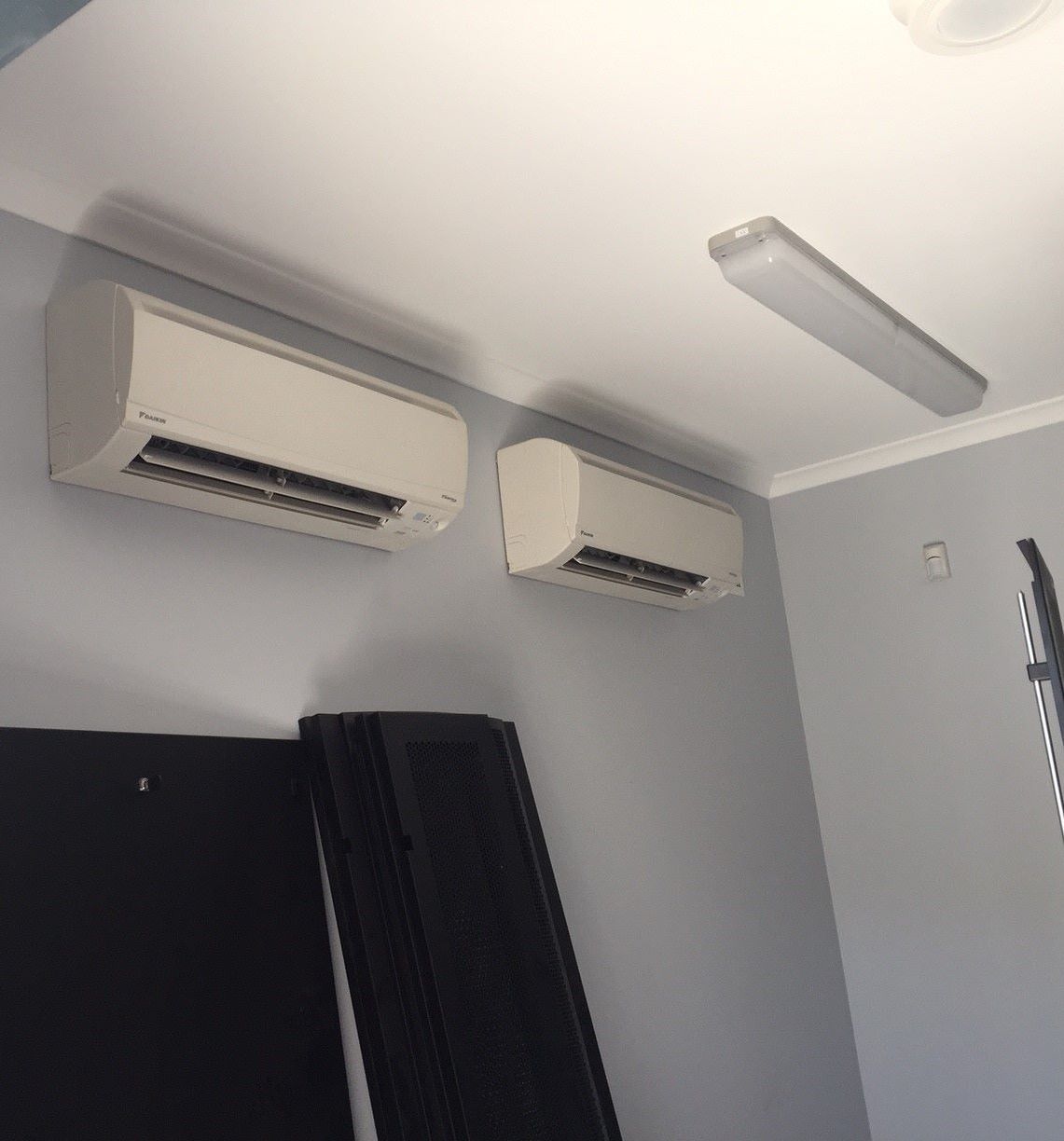 Electrician Repairing Air Conditioner Ind — 7E Integrated Services In Newcastle NSW
