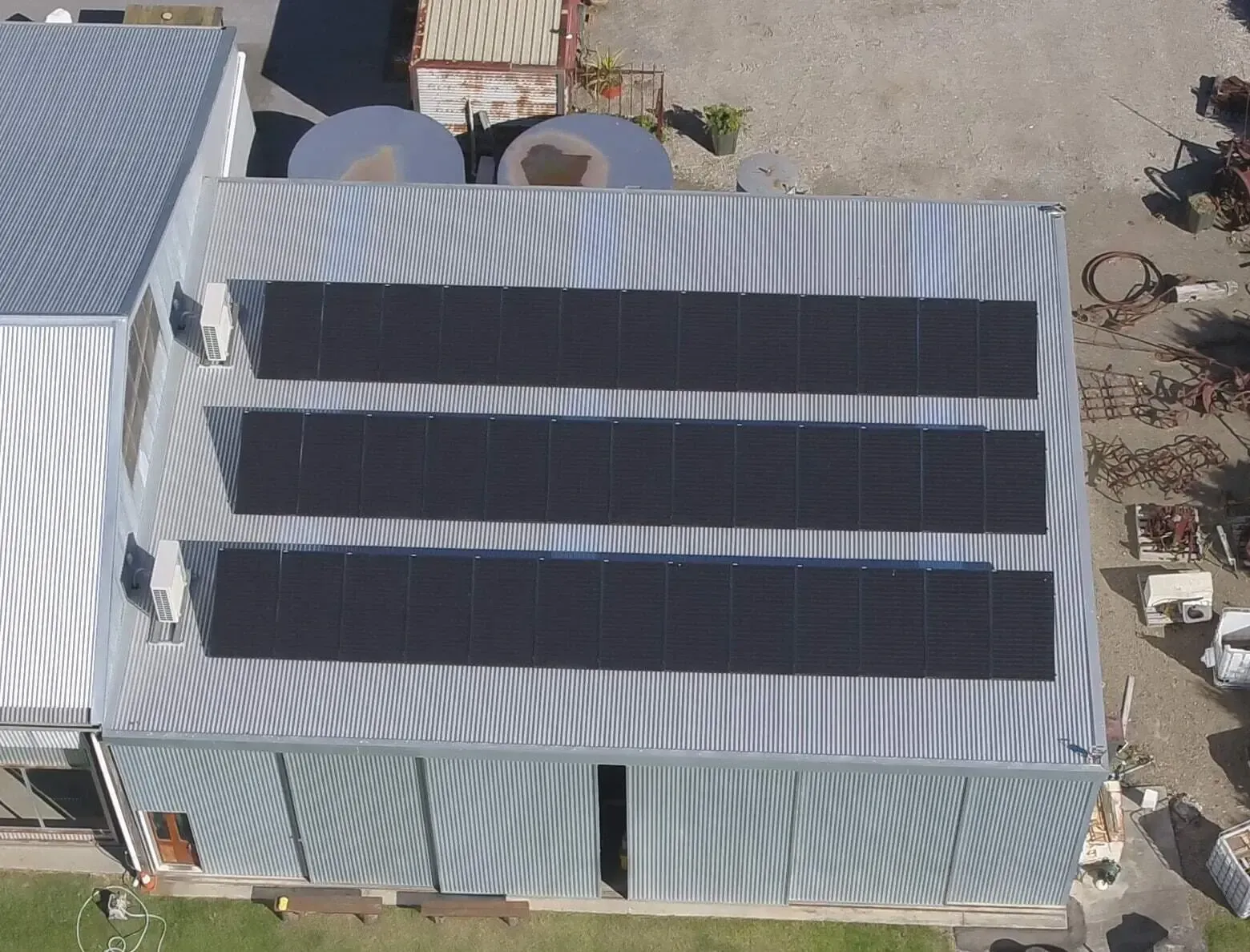 Commercial building with solar panels — 7E Integrated Services In Bolwarra Heights NSW