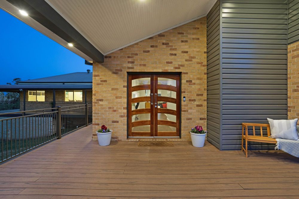 Frontdoor of House with Light — 7E Integrated Services In Bolwarra Heights, NSW
