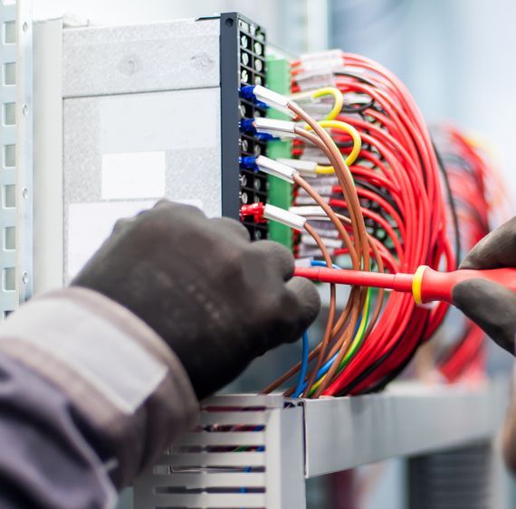 Electrician Works With Wlectric Cable Wires Of Fuse Switch Box — 7E Integrated Services In Newcastle NSW