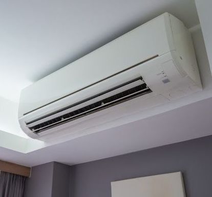 Air Conditioner Mounted On A White Wall — 7E Integrated Services In Bolwarra Heights NSW