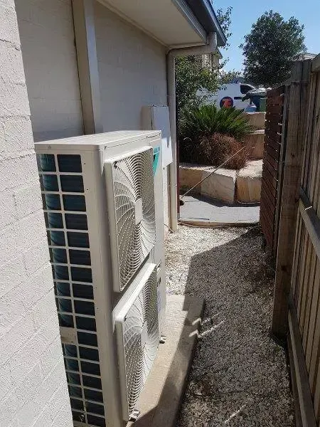 Repairman Cleaning And Fixing Indoors AC Unit — 7E Integrated Services In Maitland NSW