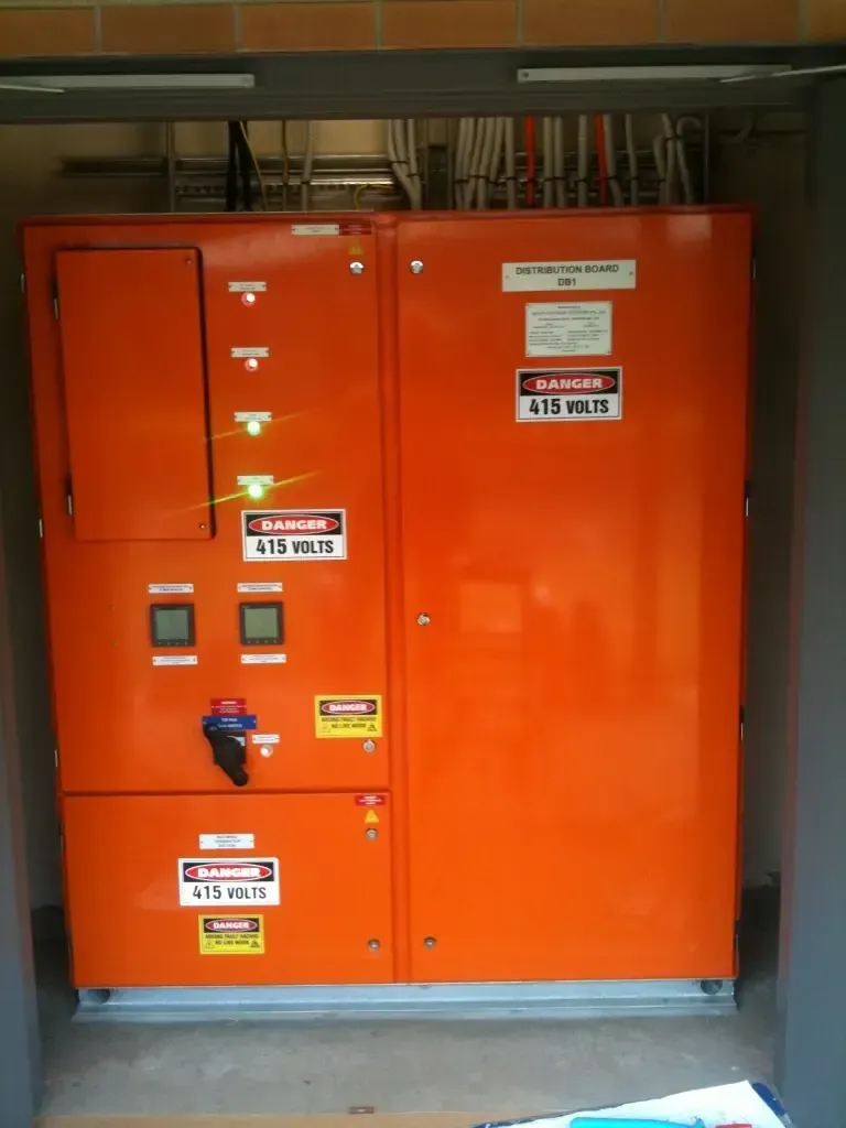 Technician Checks Electrical Power Panel In The Building — 7E Integrated Services In Maitland NSW