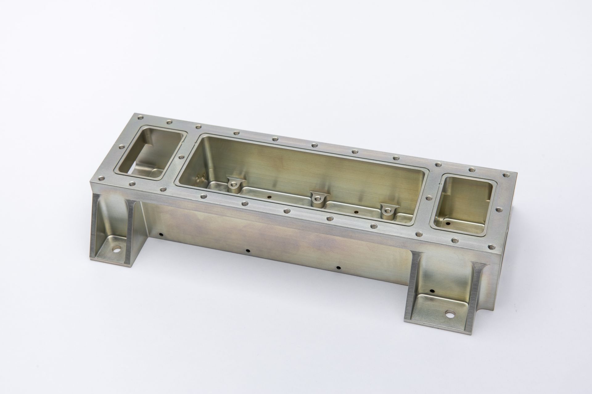 Metal rectangular enclosure with flanges, holes, and interior structure, likely for electronics.