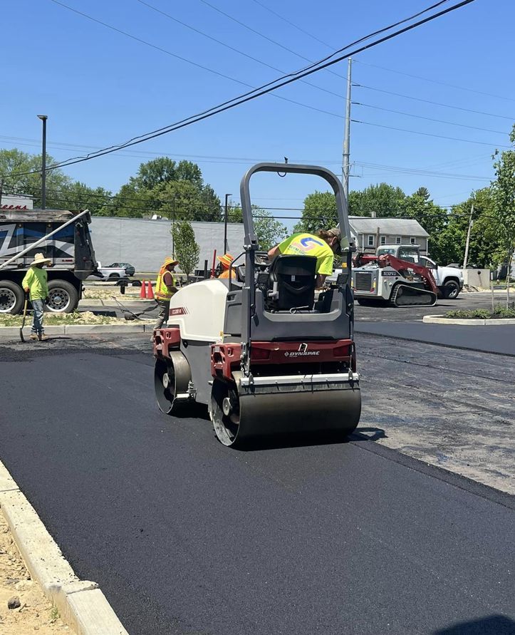rolling freshly installed asphalt