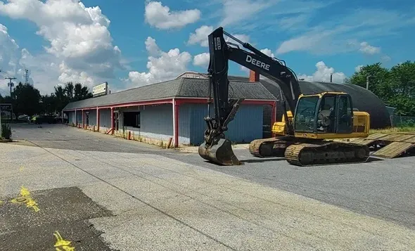 tearing+down+Carls+hardware+store+and+parking+lot+to+make+way+for+new+chipotle+and+retail+in+bridgeton
