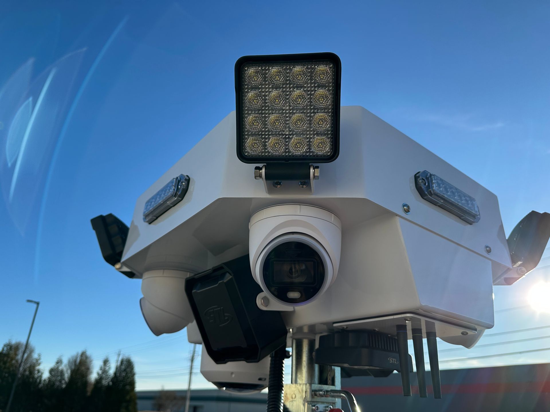 A white box with a camera on top of it