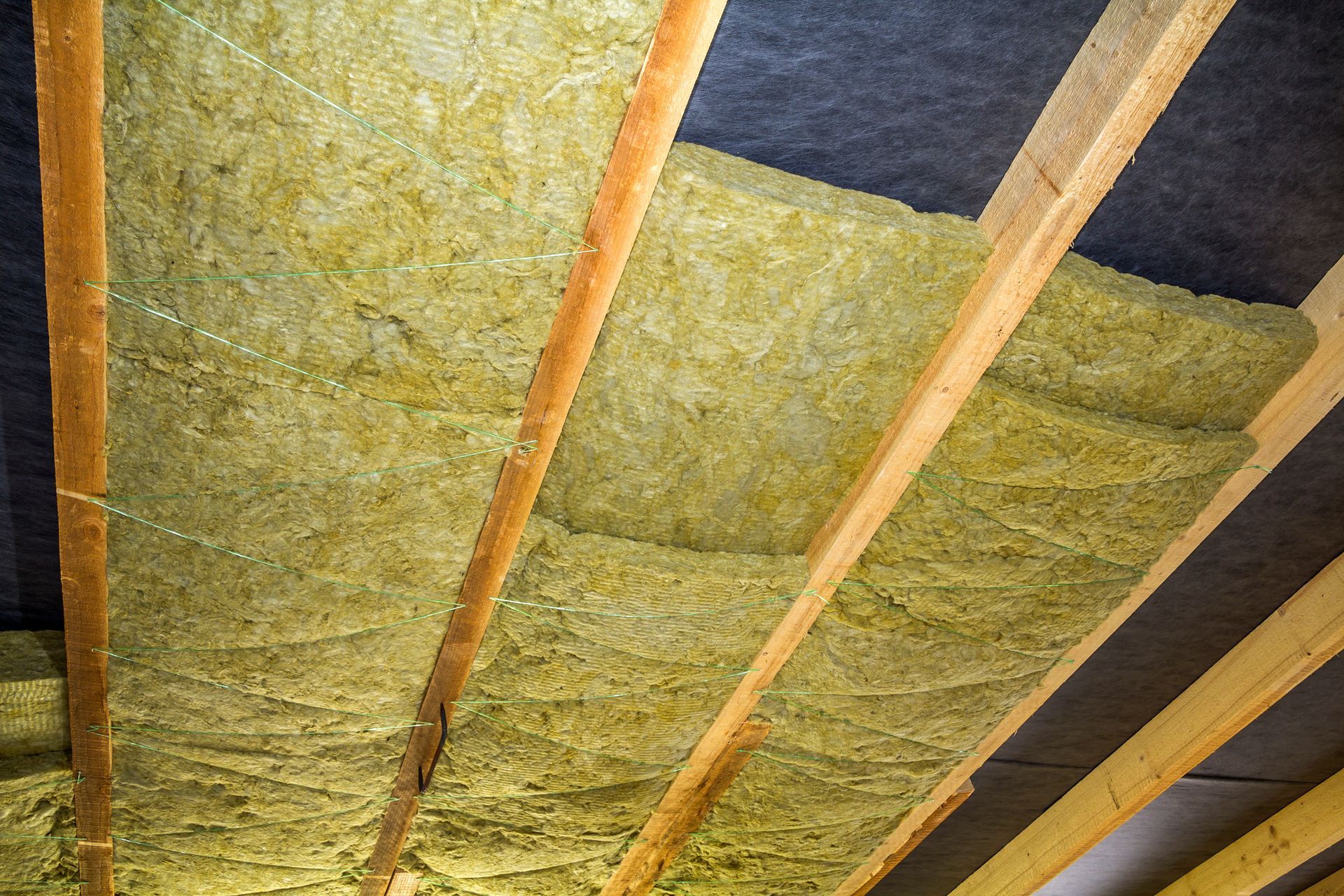 There is a lot of insulation on the ceiling of a building.