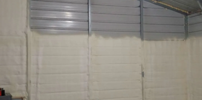 A garage is being insulated with spray foam.