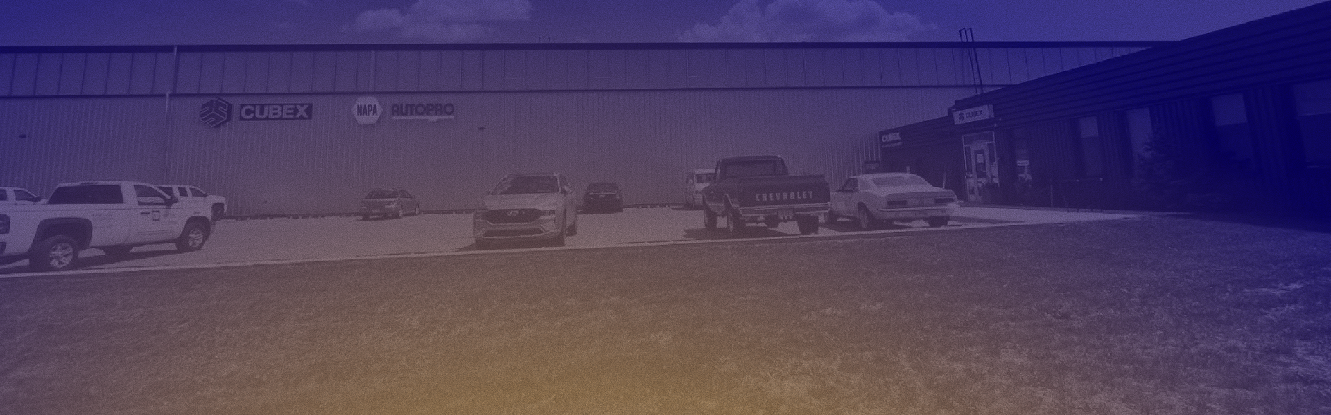 parking lot with cars and trucks in it | Kirkham Automotive