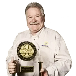 man holding award | Kirkham Automotive