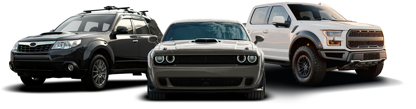 A white sedan and a red sports car parked next to each other.