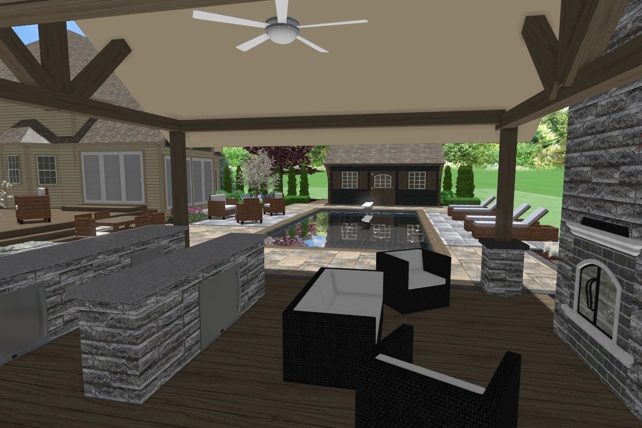 Outdoor kitchen and living space with pool and fireplace.