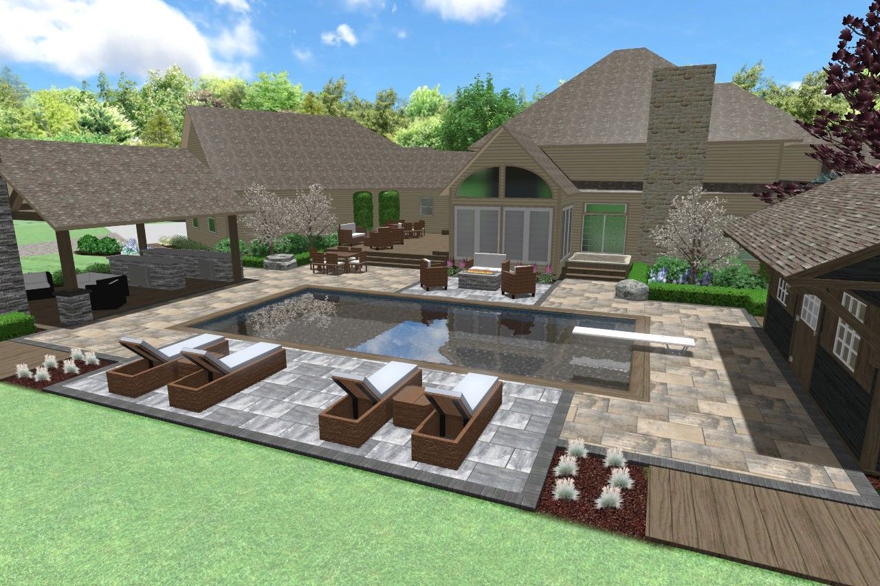 Luxury backyard with pool, lounge chairs, and stone patio, adjacent to a large house.