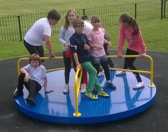 Kids on Blue Playground Roundabout