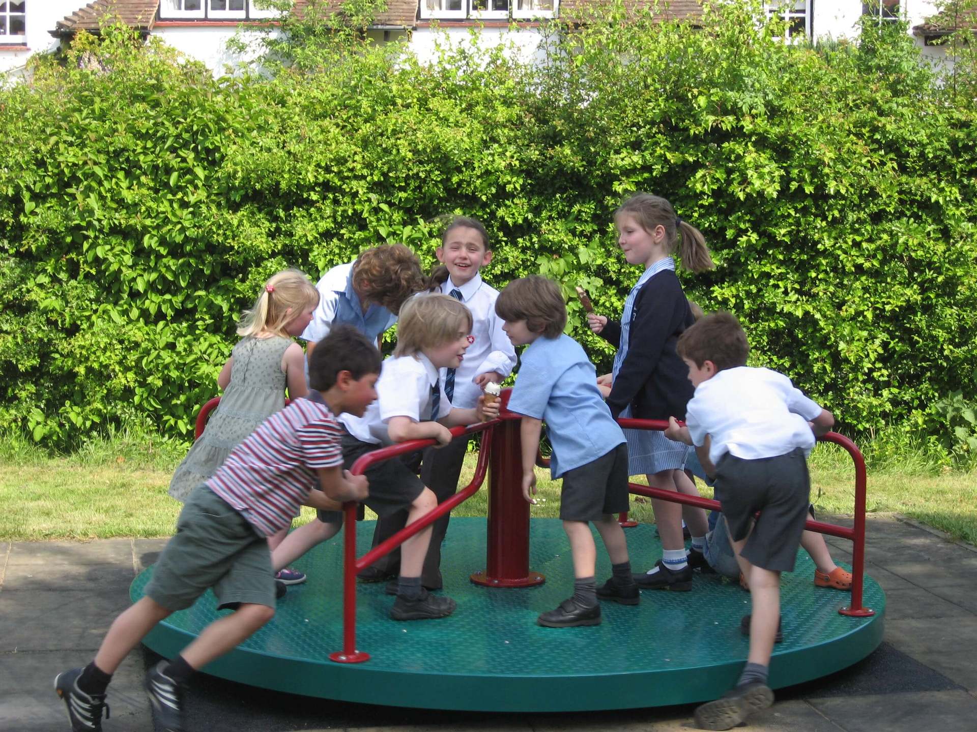 Children on Playground Roundabout