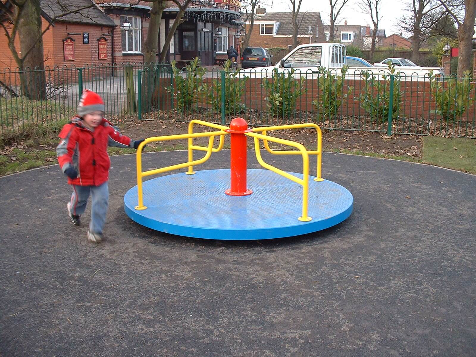 Child Standing Next to Playground Roundabout