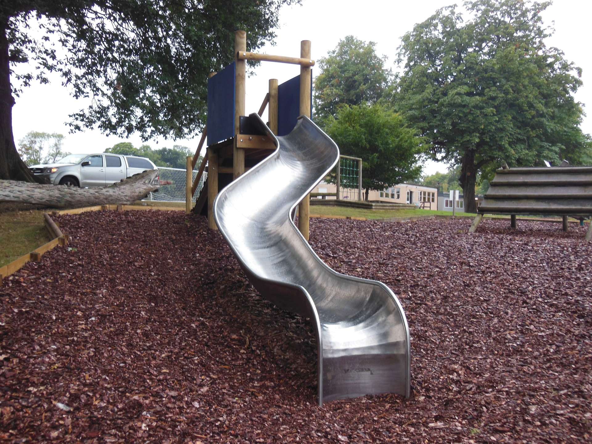 Curved Playground Slide on Wood Chippings