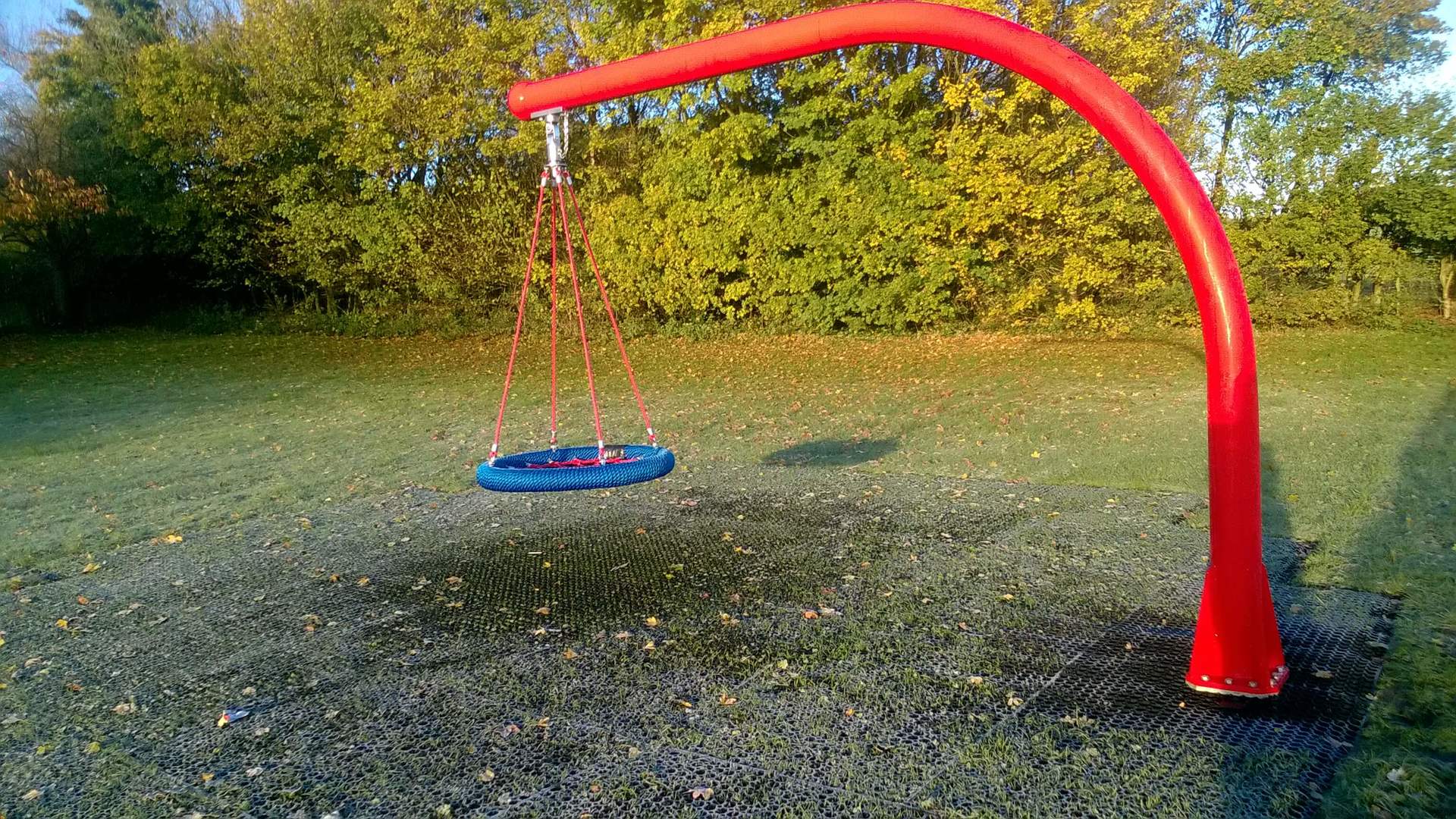 Playground Swing in Grass Park