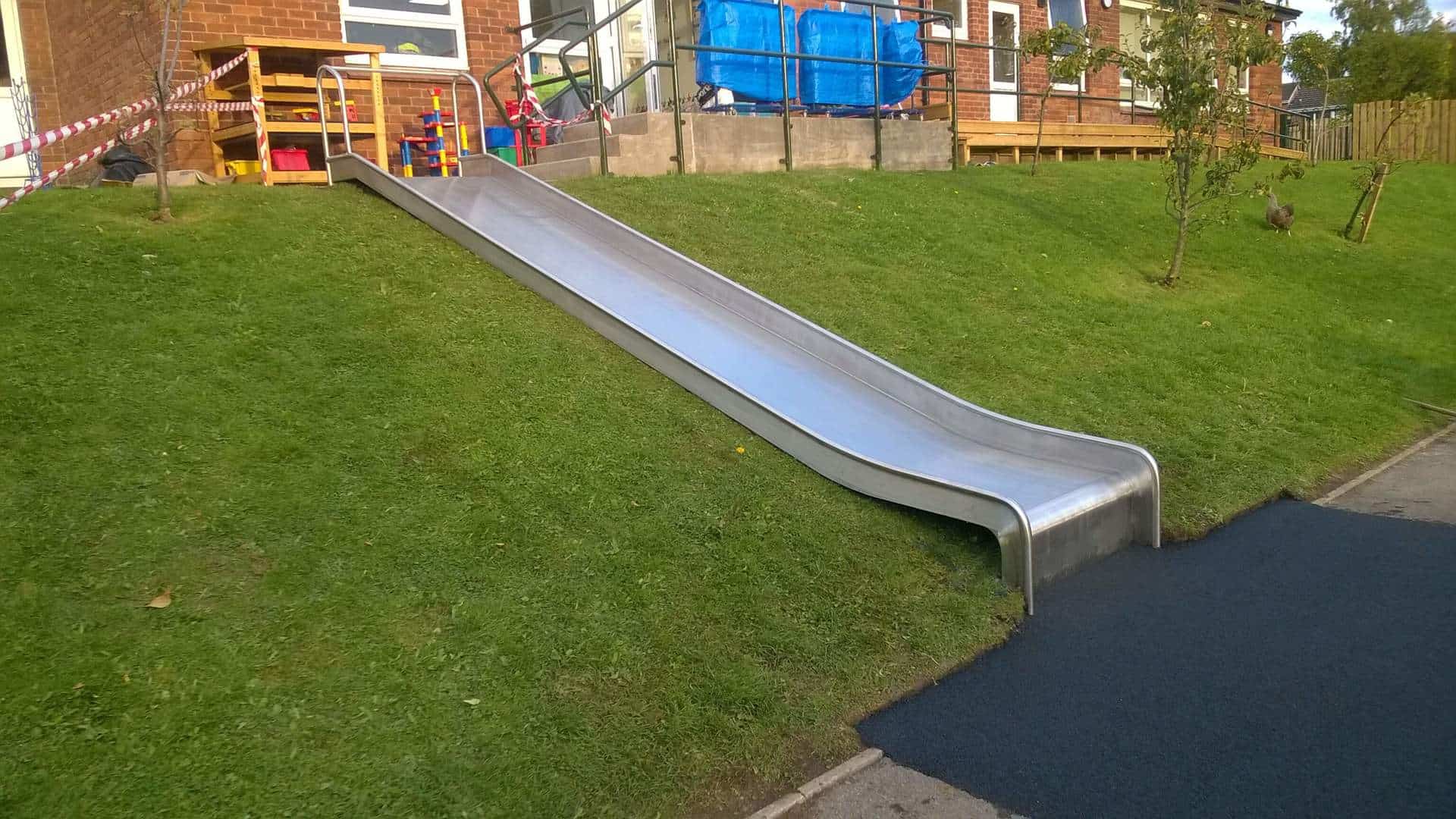 Playground Slide in Grass Bank