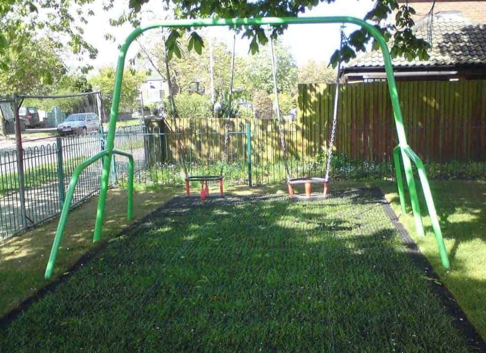green swing on a playground