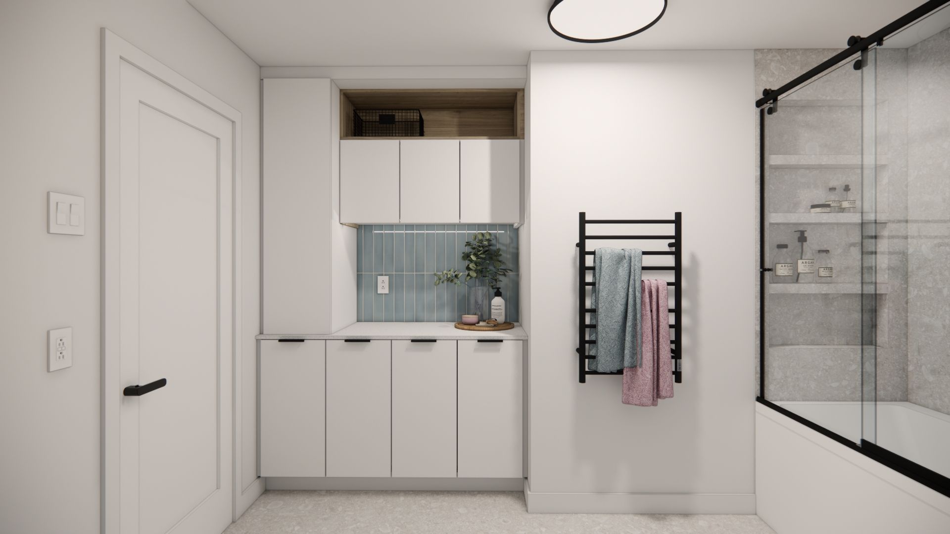 Salle de bains blanche avec rangements intégrés, porte-serviettes noir et porte de douche en verre.