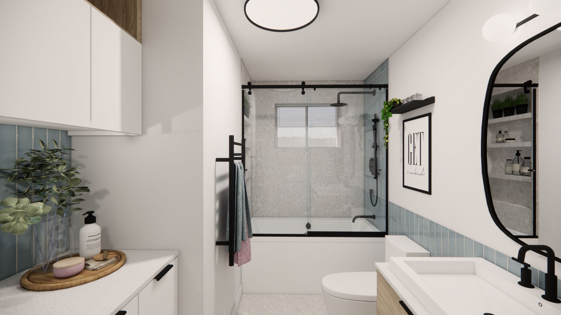 Salle de bains moderne avec carrelage bleu, porte de douche en verre et miroir rond.