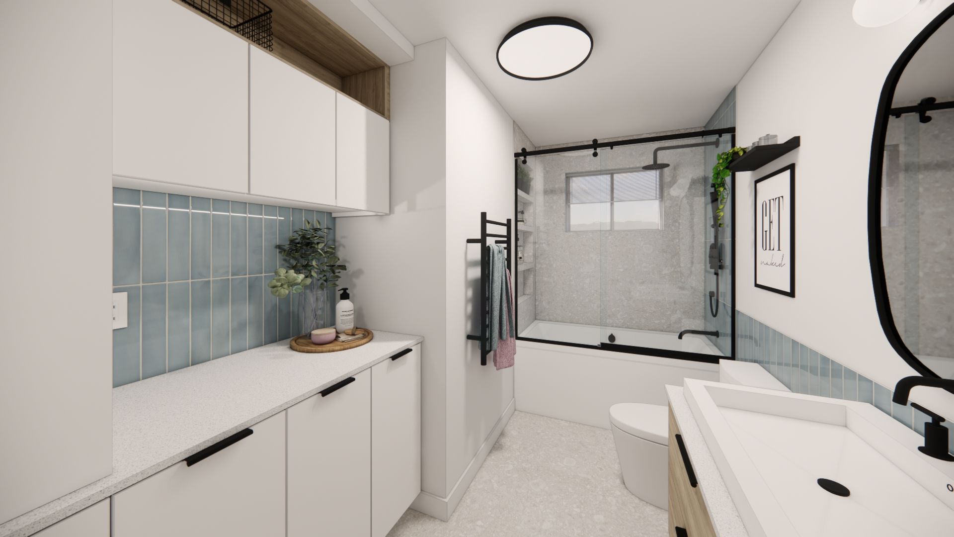 Intérieur de la salle de bains : meubles blancs, carrelage bleu, douche à cadre noir et grand miroir avec des accents noirs.