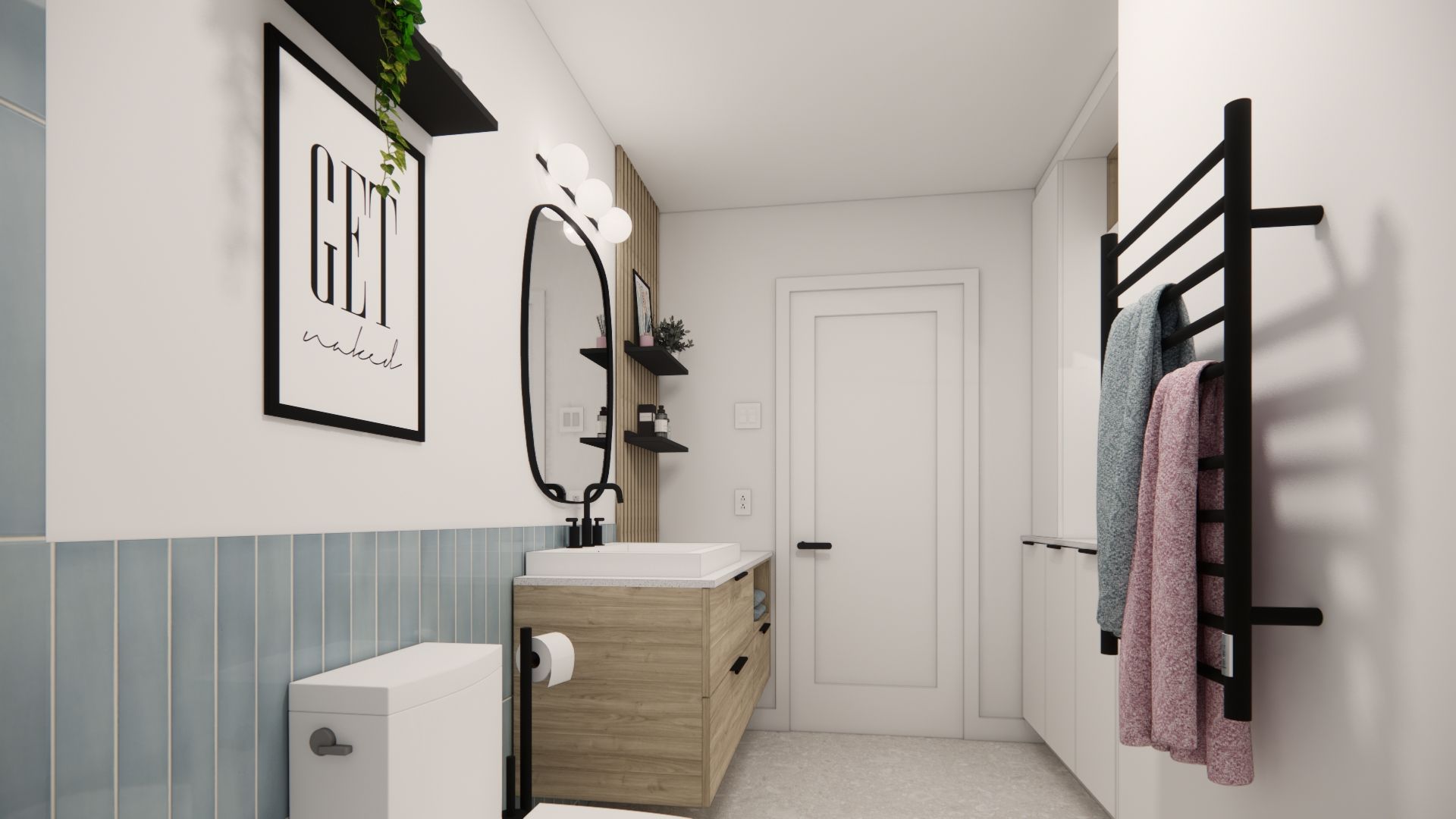 Salle de bains avec carrelage bleu, meuble-lavabo en bois, sèche-serviettes noir et tableau encadré « GET ».