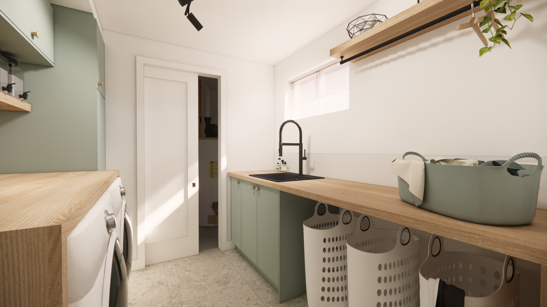 Buanderie avec placards verts, plan de travail en bois, évier et sacs à linge suspendus.