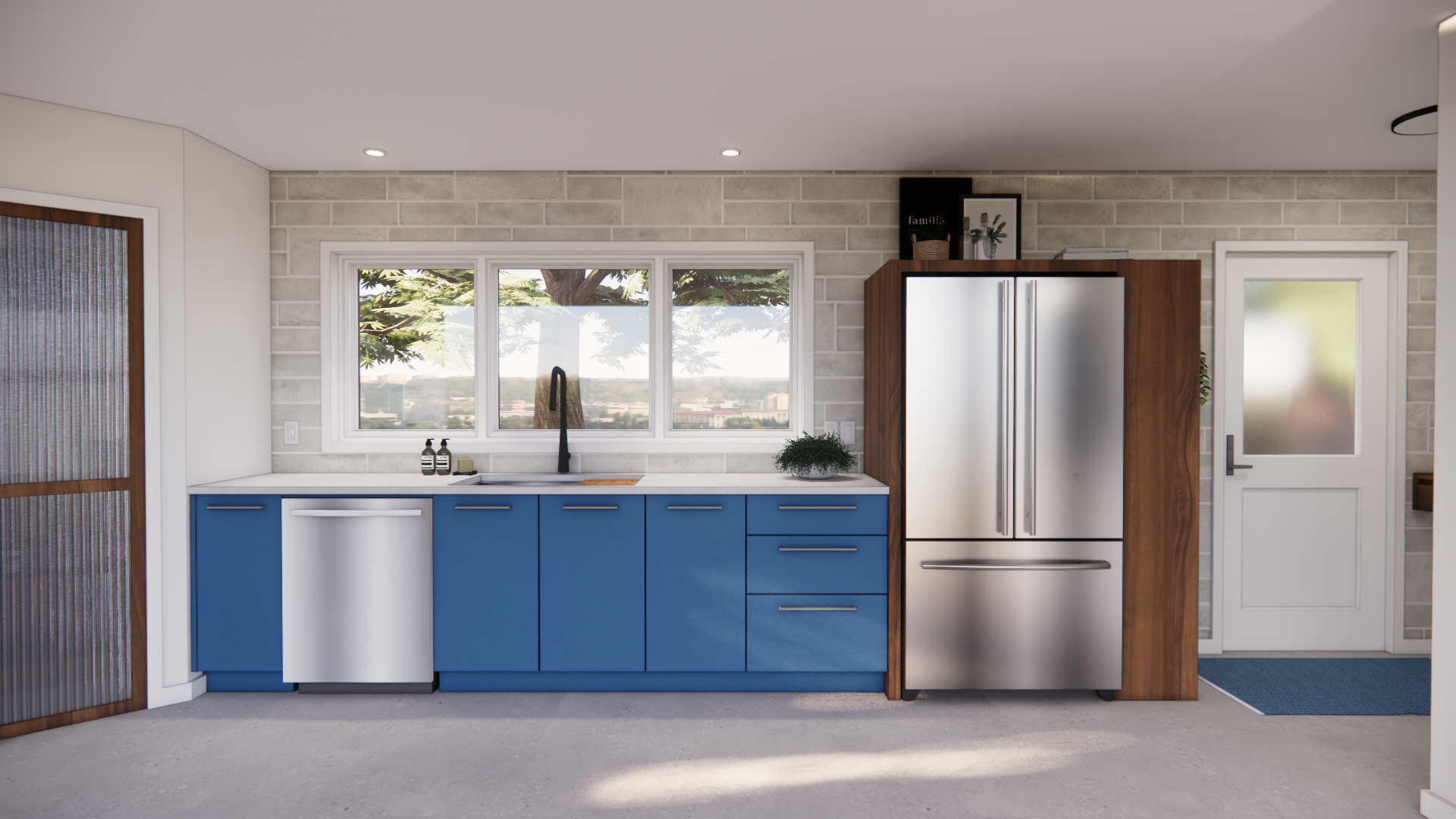 Cuisine avec placards bleus, appareils électroménagers en acier inoxydable et une fenêtre donnant sur un jardin arboré.