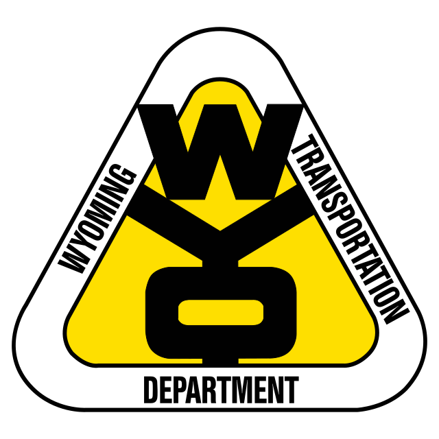 The wyoming transportation department logo is yellow and black