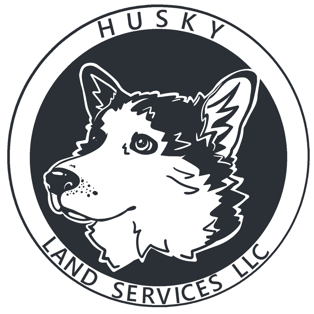 The logo for husky land services llc shows a husky dog 's head in a circle.