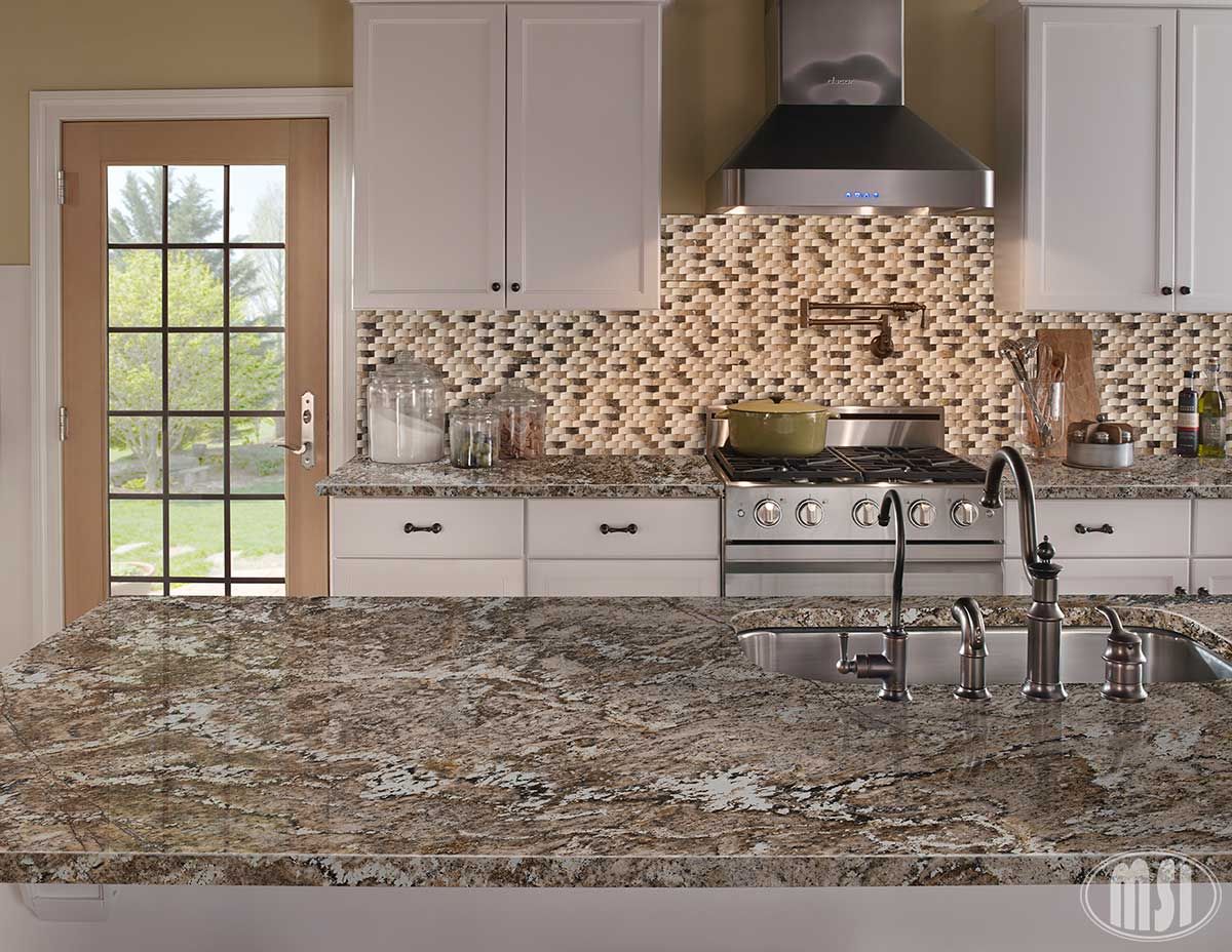 a kitchen with granite counter tops and stainless steel appliances