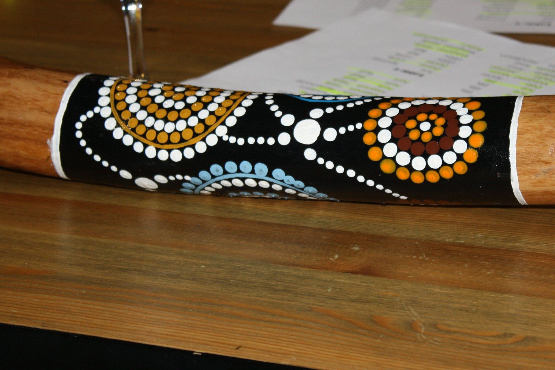 A wooden stick with a colorful design on it