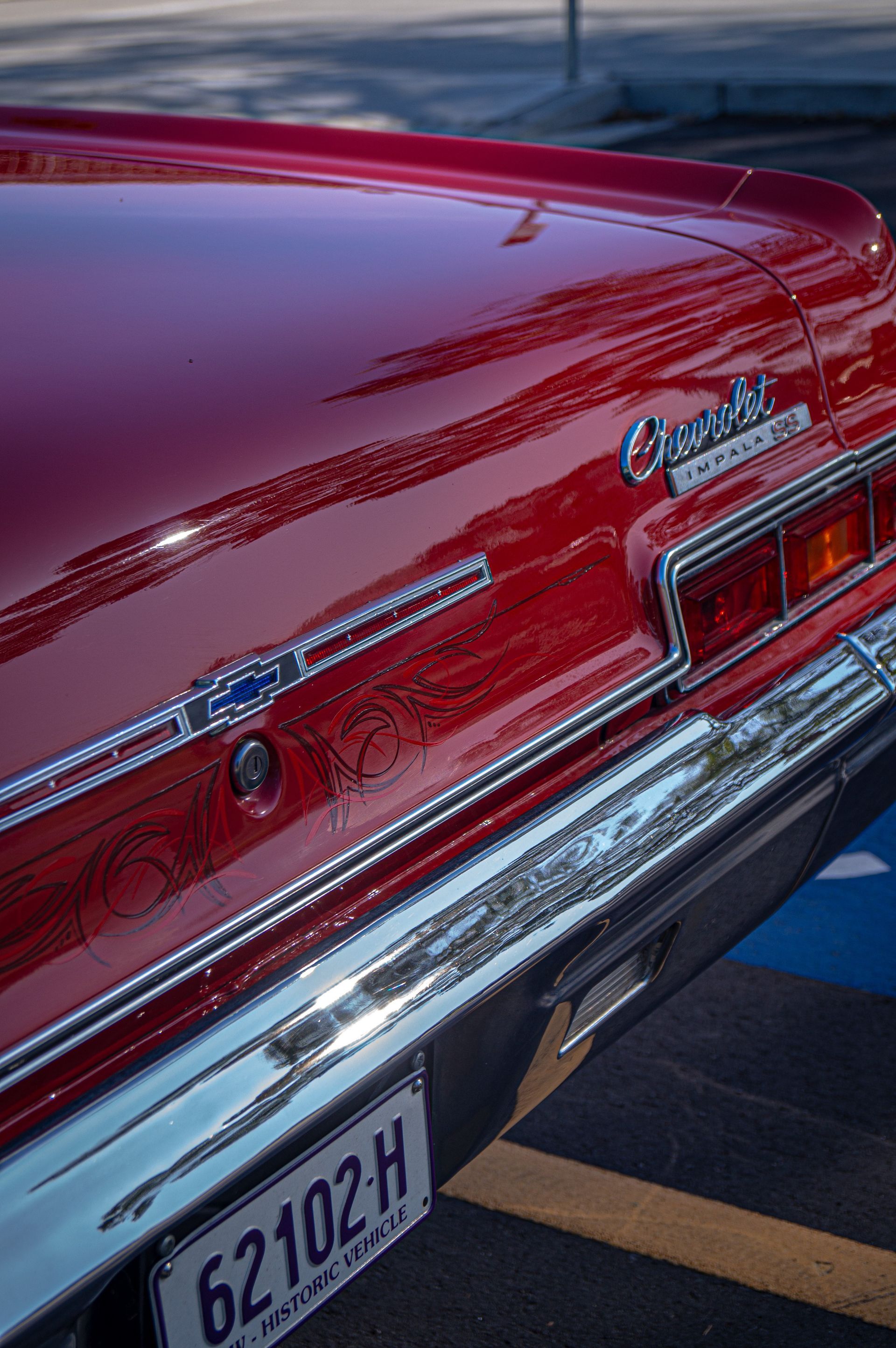 A red car with a license plate that says 62102 h