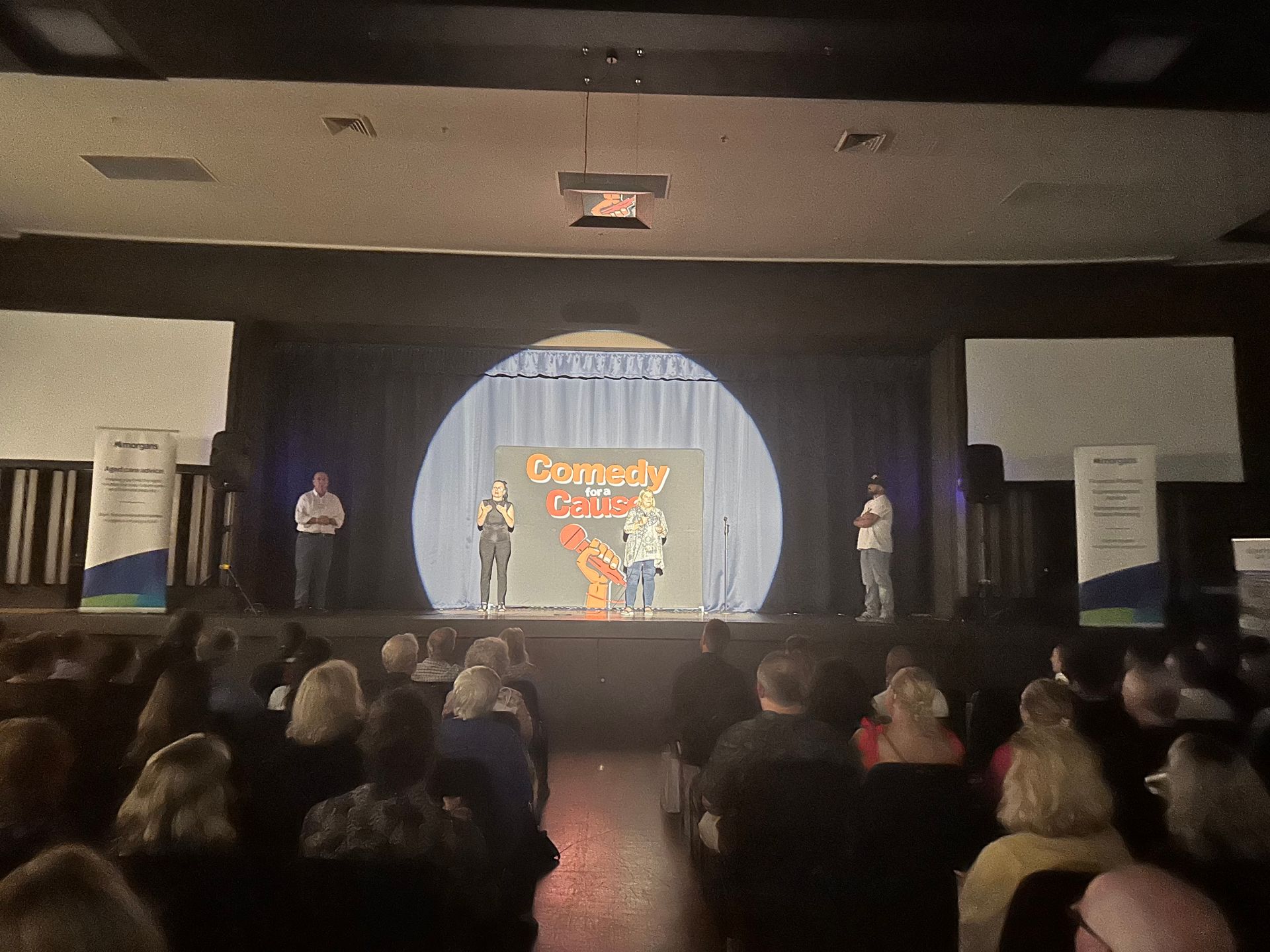 A group of people are watching a comedy show