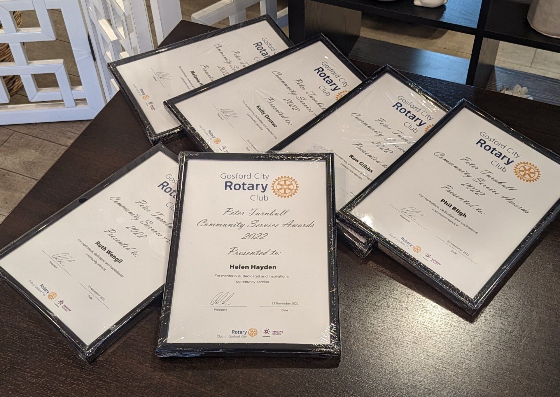 A bunch of certificates with the word rotary on them