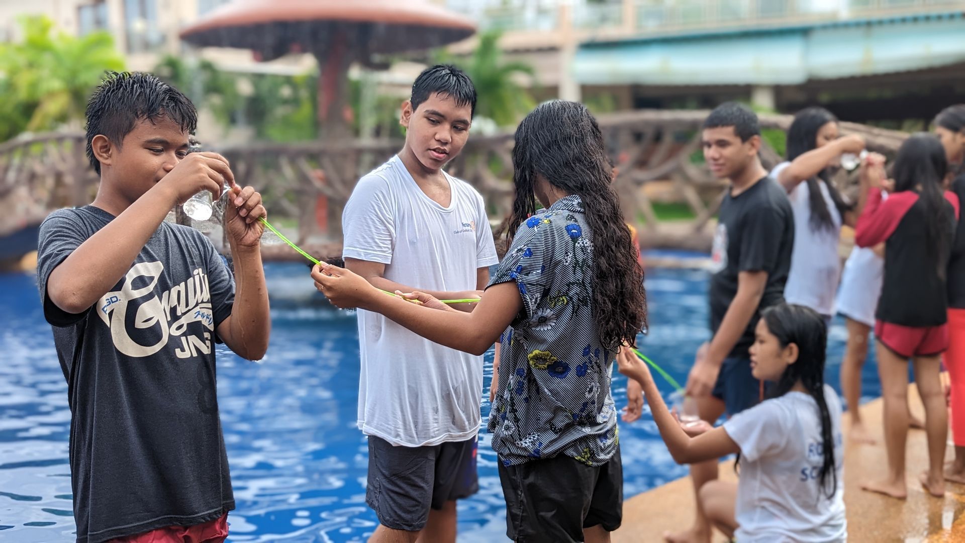 A group of children are playing in a swimming pool.