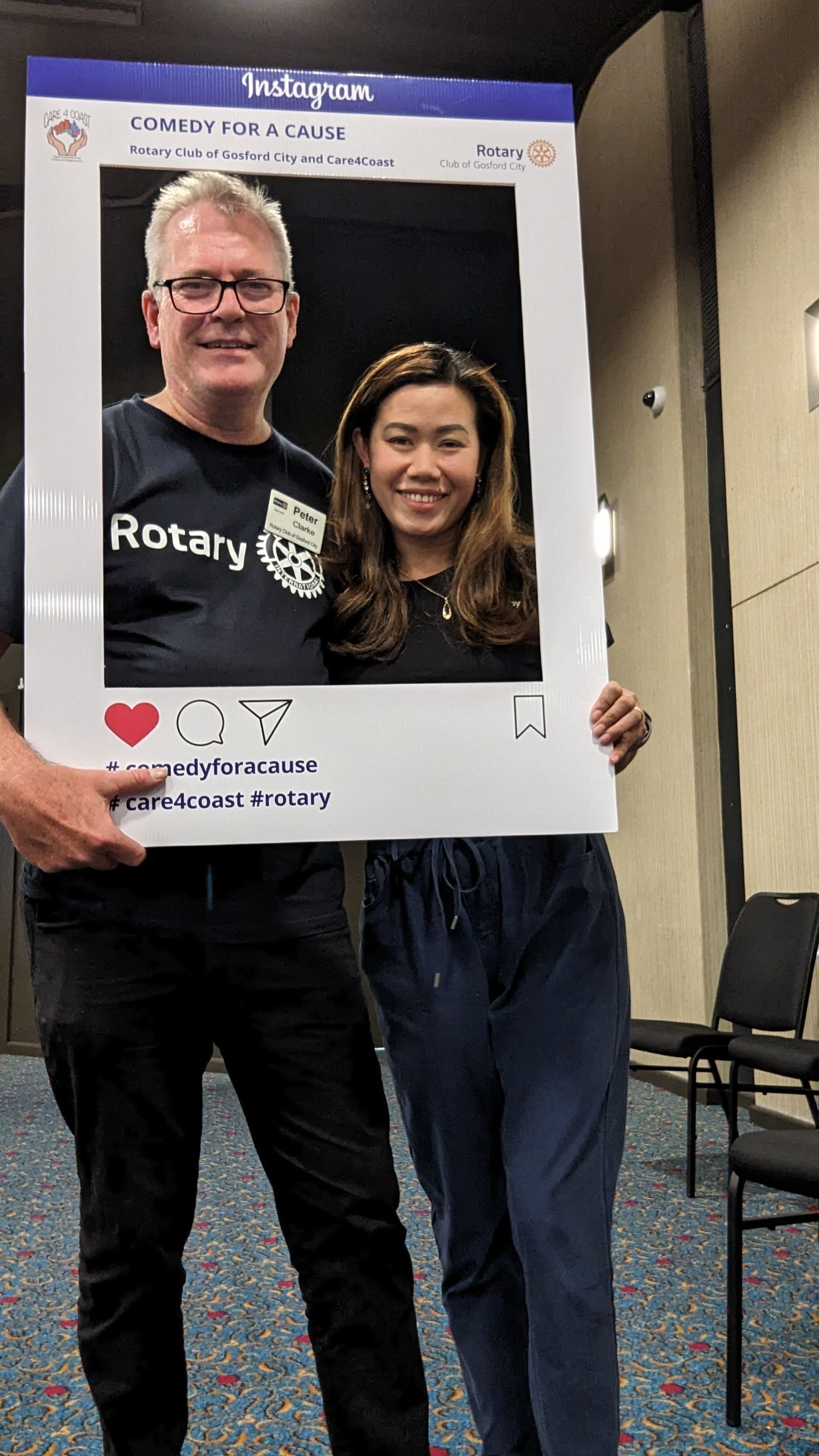 A man and a woman are posing for a picture in a picture frame.