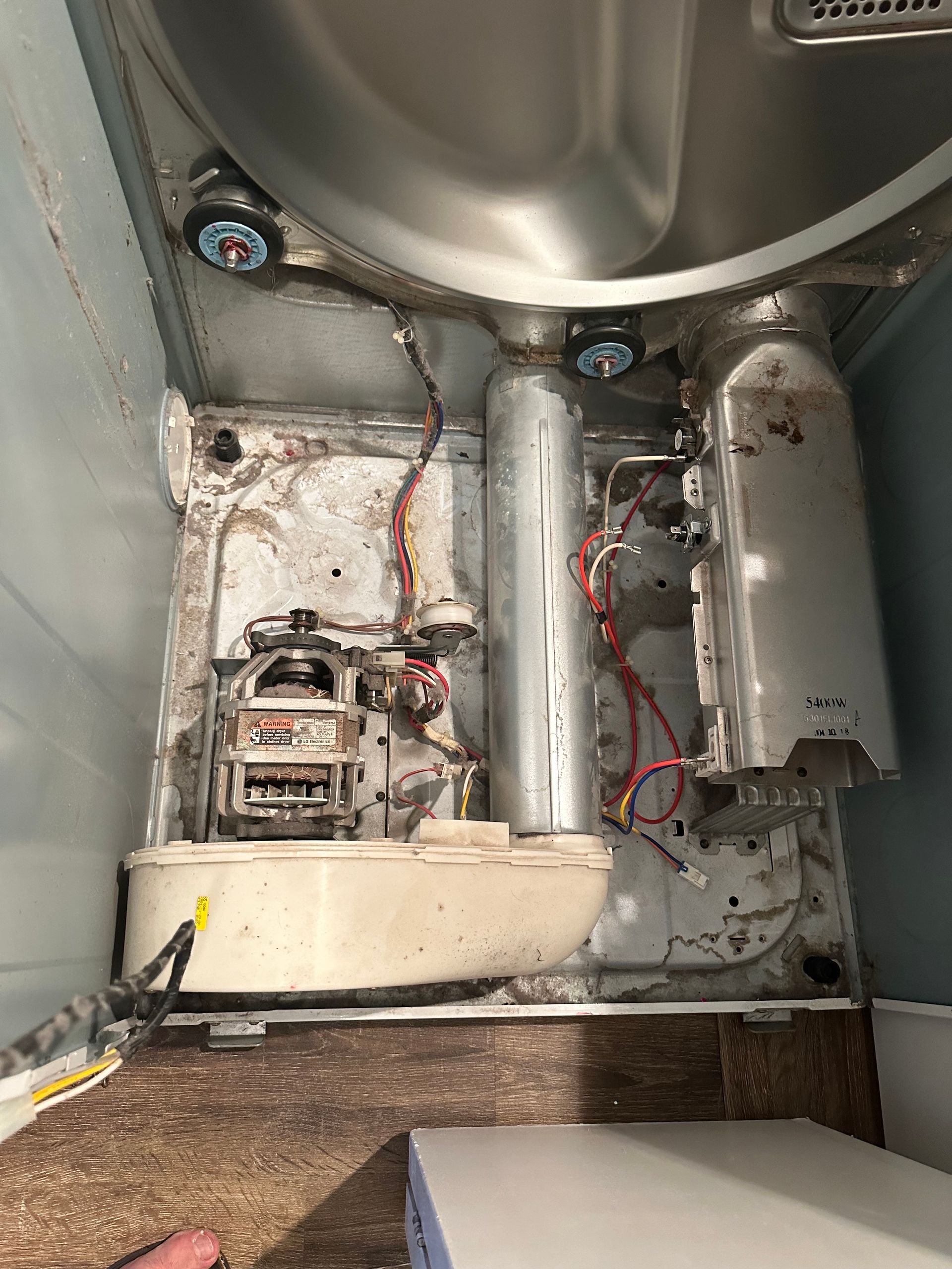 The inside of a washing machine with the door open.