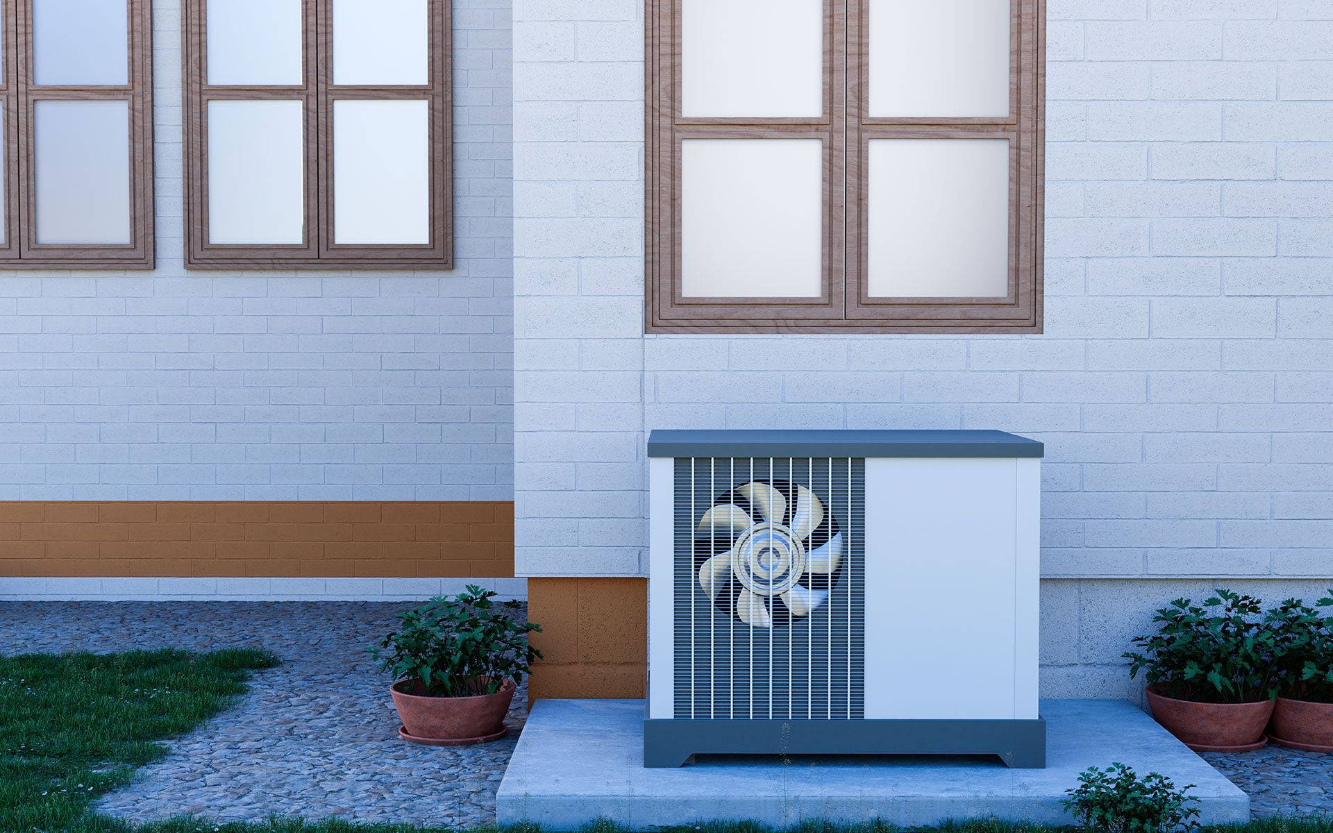 A white brick house with a fan on the side of it.