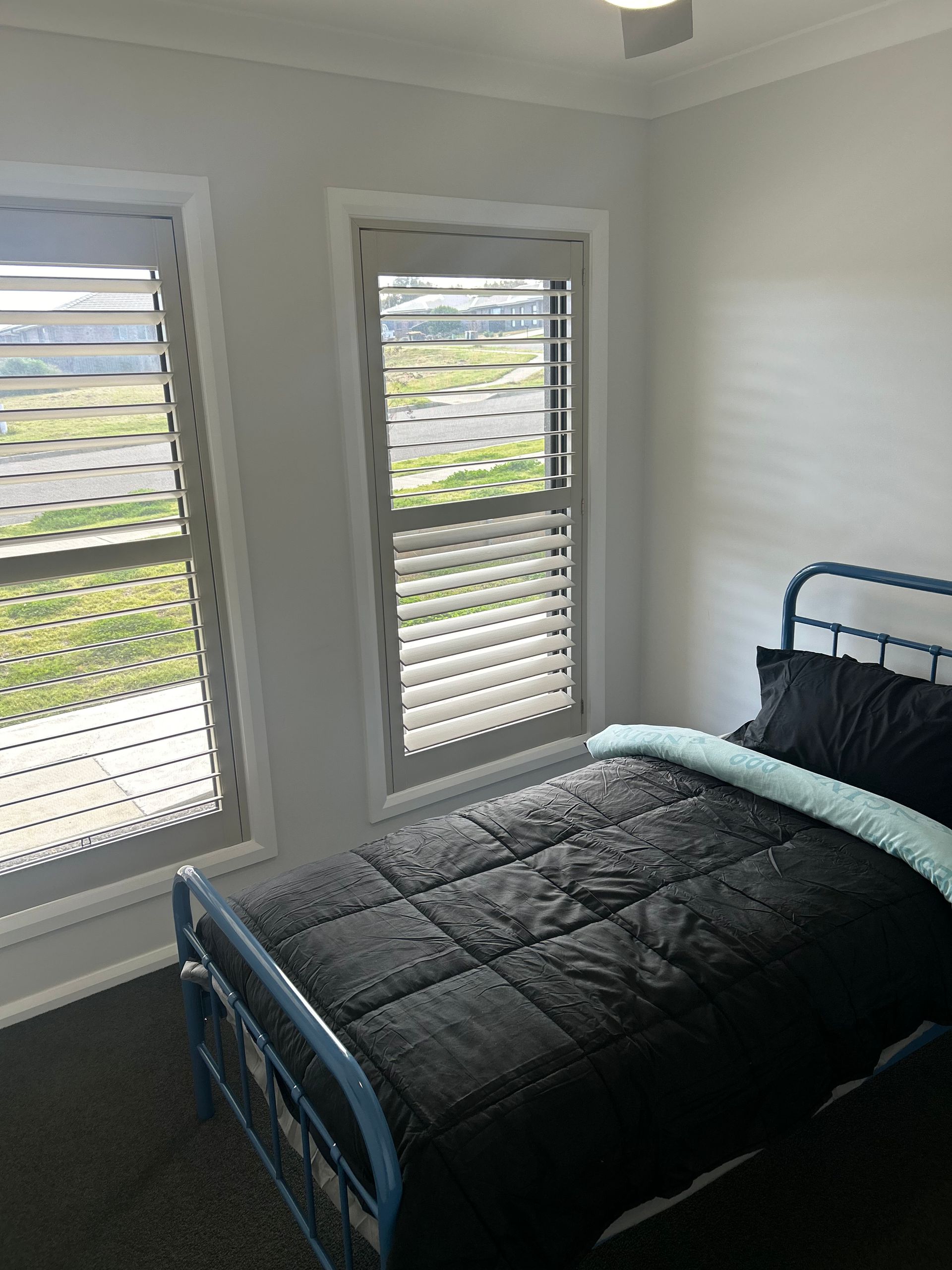 An Older Couple Is Sitting At A Table Talking To A Man — Active Ables Community Services In Tamworth, NSW