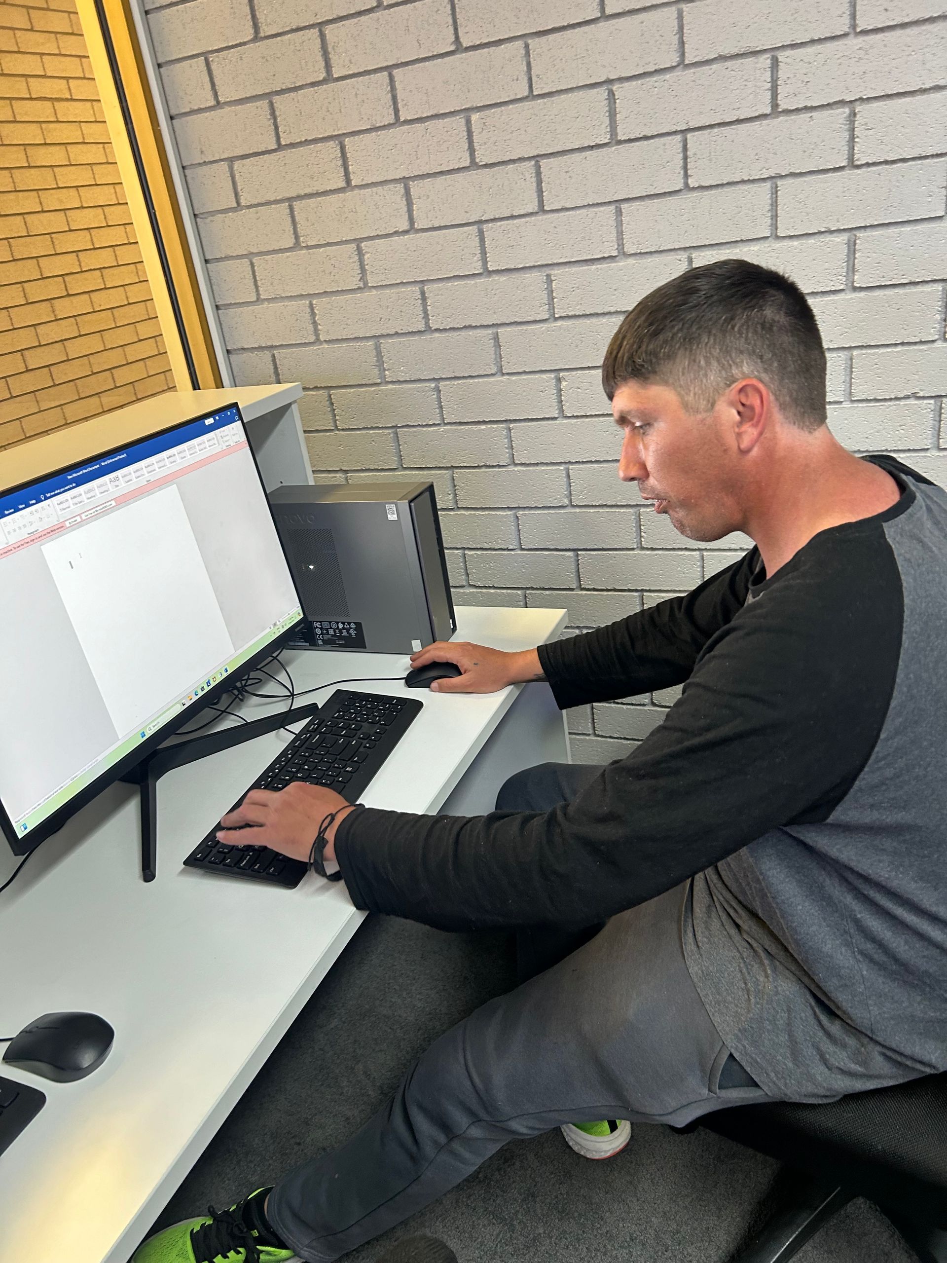 A Man And A Woman Are Holding Hands While Sitting On A Couch — Active Ables Community Services In Tamworth, NSW