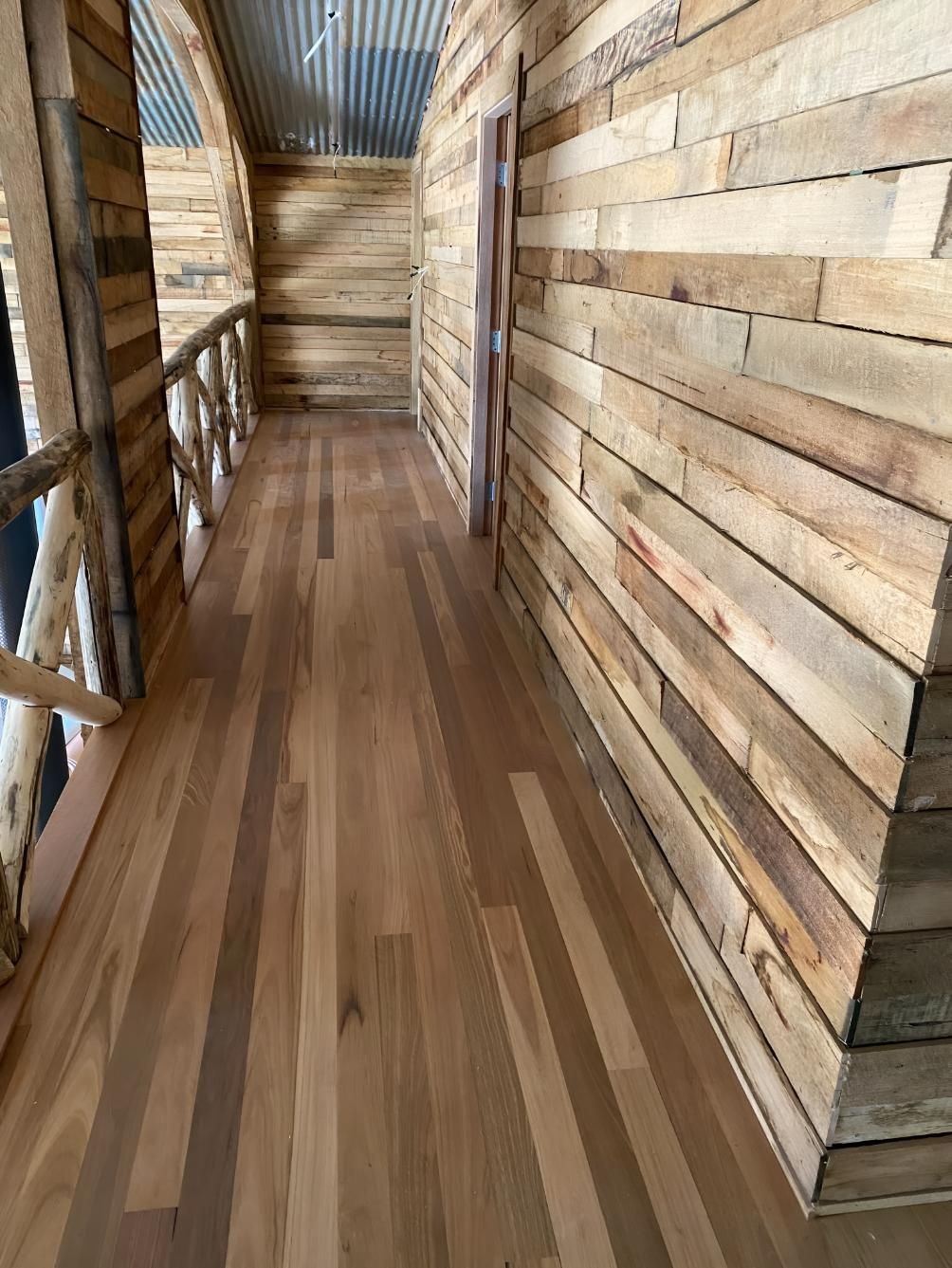 A Hallway With Wooden Walls And Floors In A Cabin — Coolangatta Floor Sanding In Shoalhaven Heads, NSW