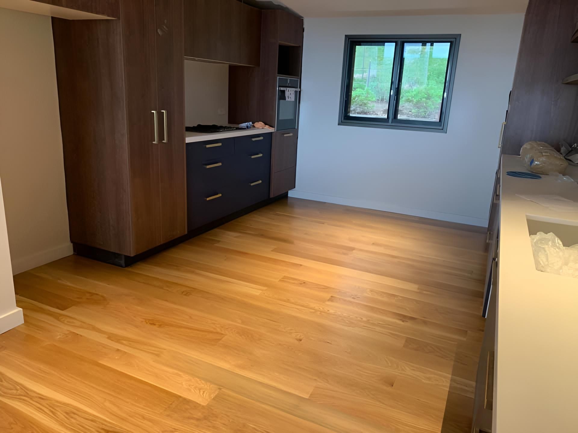 A Room With A Wooden Cabinet — Coolangatta Floor Sanding In Kiama, NSW