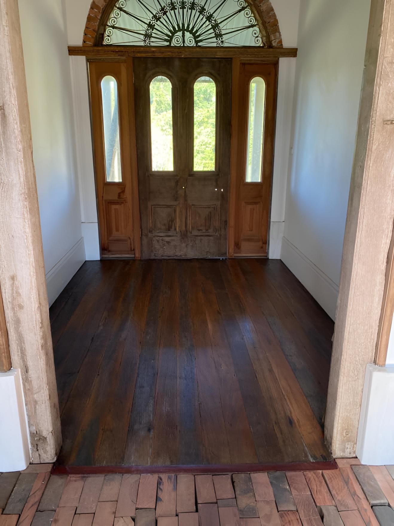 A Hallway With A Wooden Floor And A Wooden Door — Coolangatta Floor Sanding In Nowra, NSW