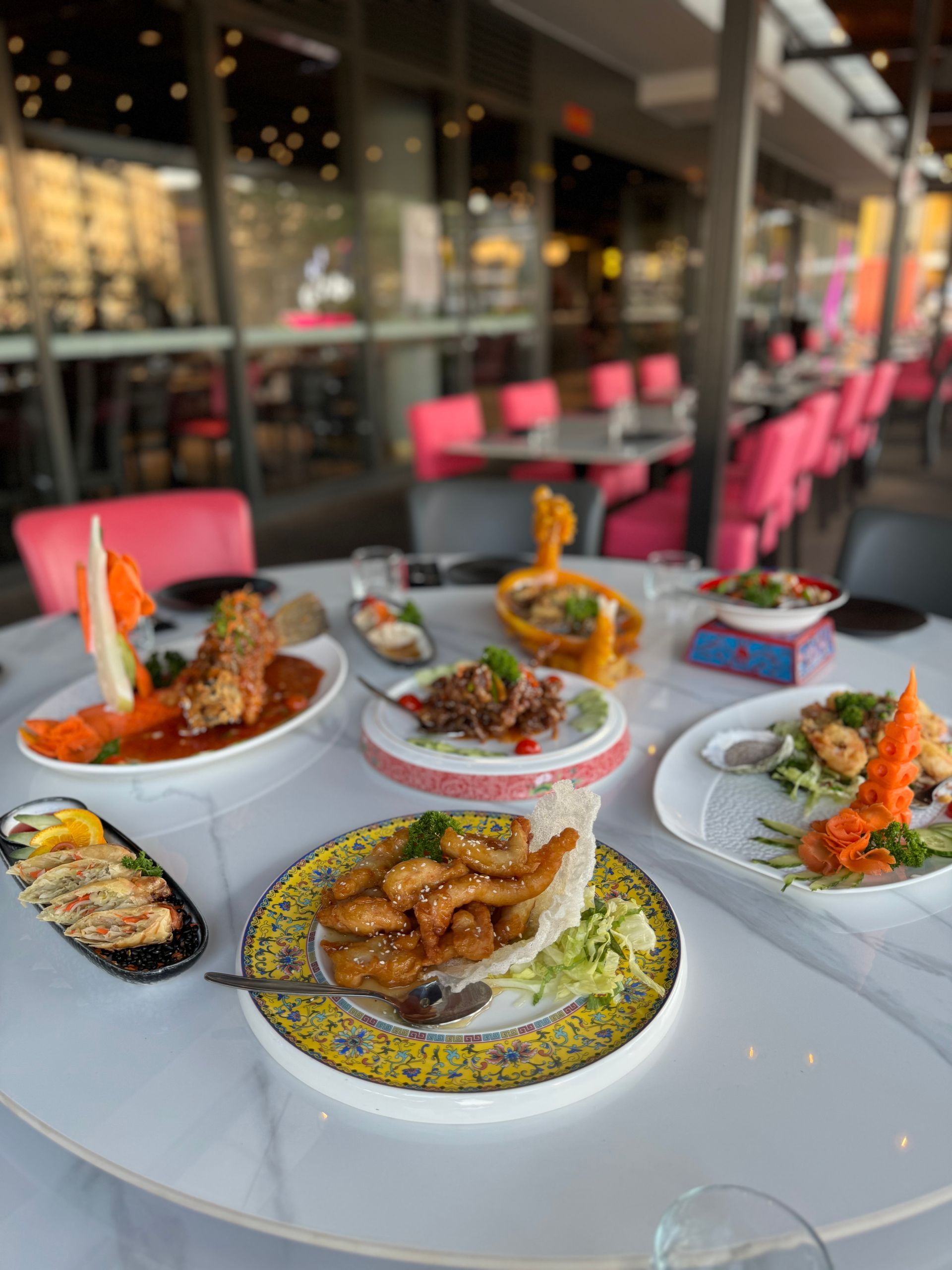 A white plate topped with roasted chicken and dipping sauce.